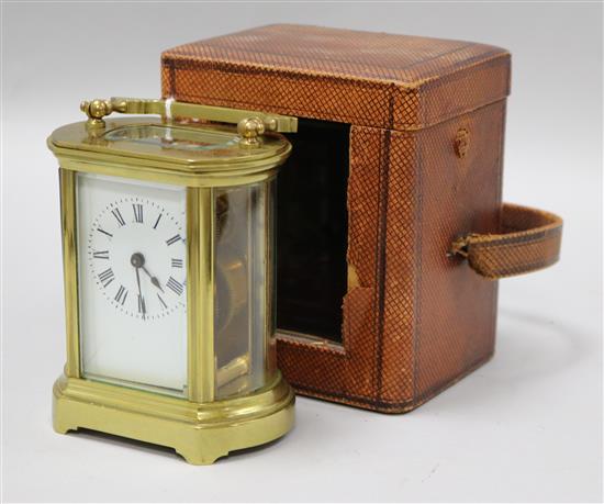 A French gilt brass carriage timepiece in leather carrying case